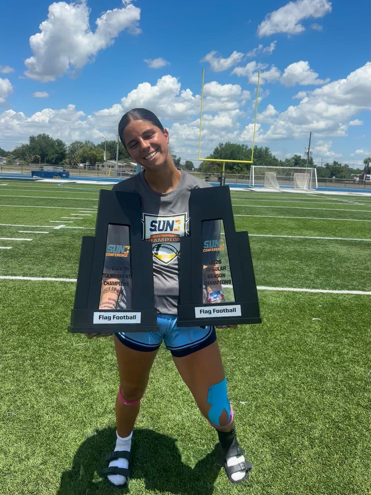 Kayleigh Thomas with the Sun Conference trophies