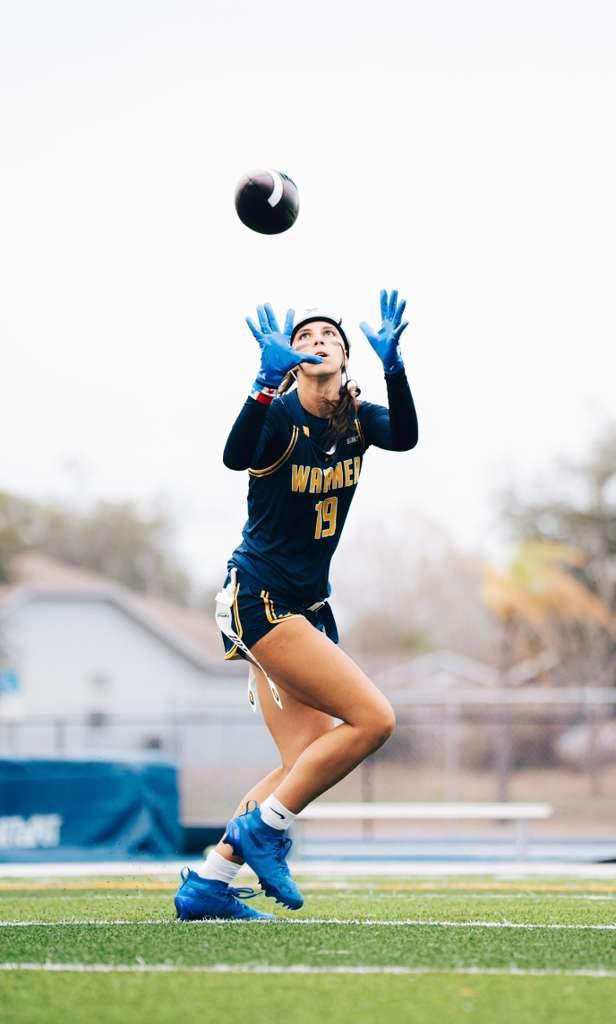 Kayleigh Thomas making a catch in her Warner University #19 jersey