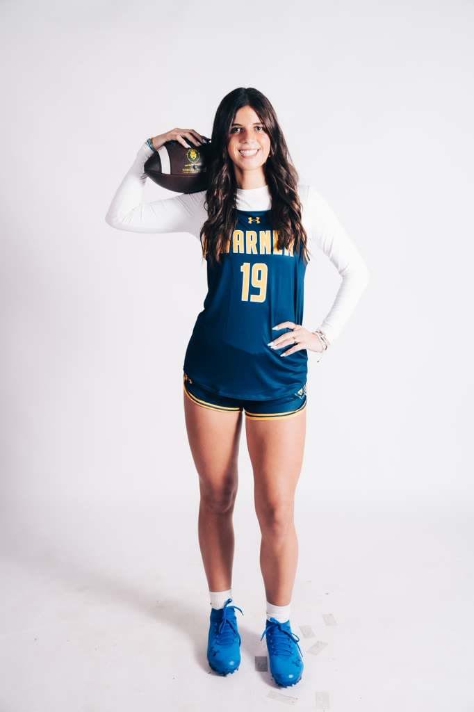 Kayleigh Thomas studio portrait in her Warner University #19 jersey